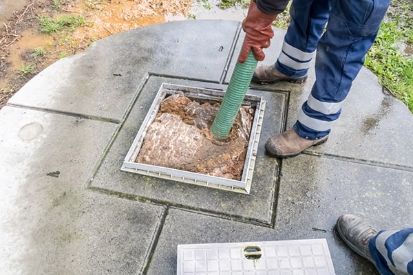 cesspool pumping involves the removal of solid waste and sludge from a cesspool using a vacuum truck